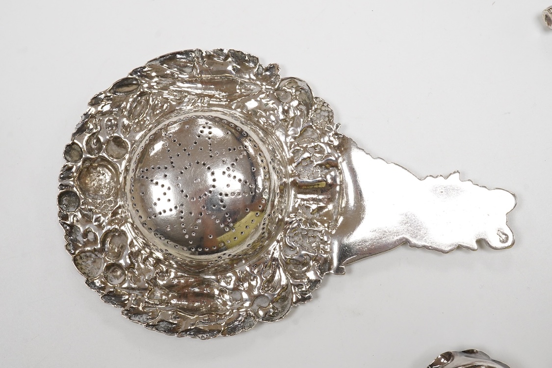 Small silver and white metal, including an Edwardian silver tea strainer, import marks for London, 1908, 15.7cm, a late Victorian silver sifter spoon, silver handled scissors with case, a white metal corkscrew and a whit